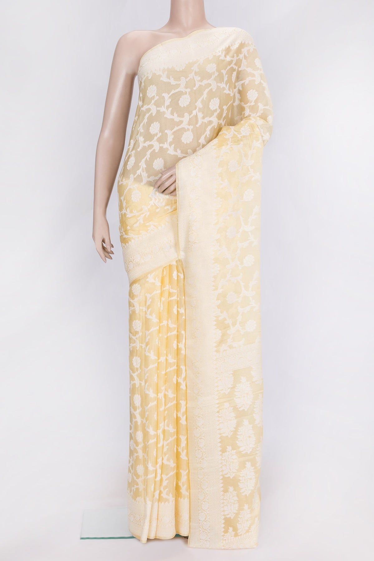 Sandal Dual Tone Mysore Georgette Saree with Zari Brocade on the body and Thread Border.  displayed on a mannequin