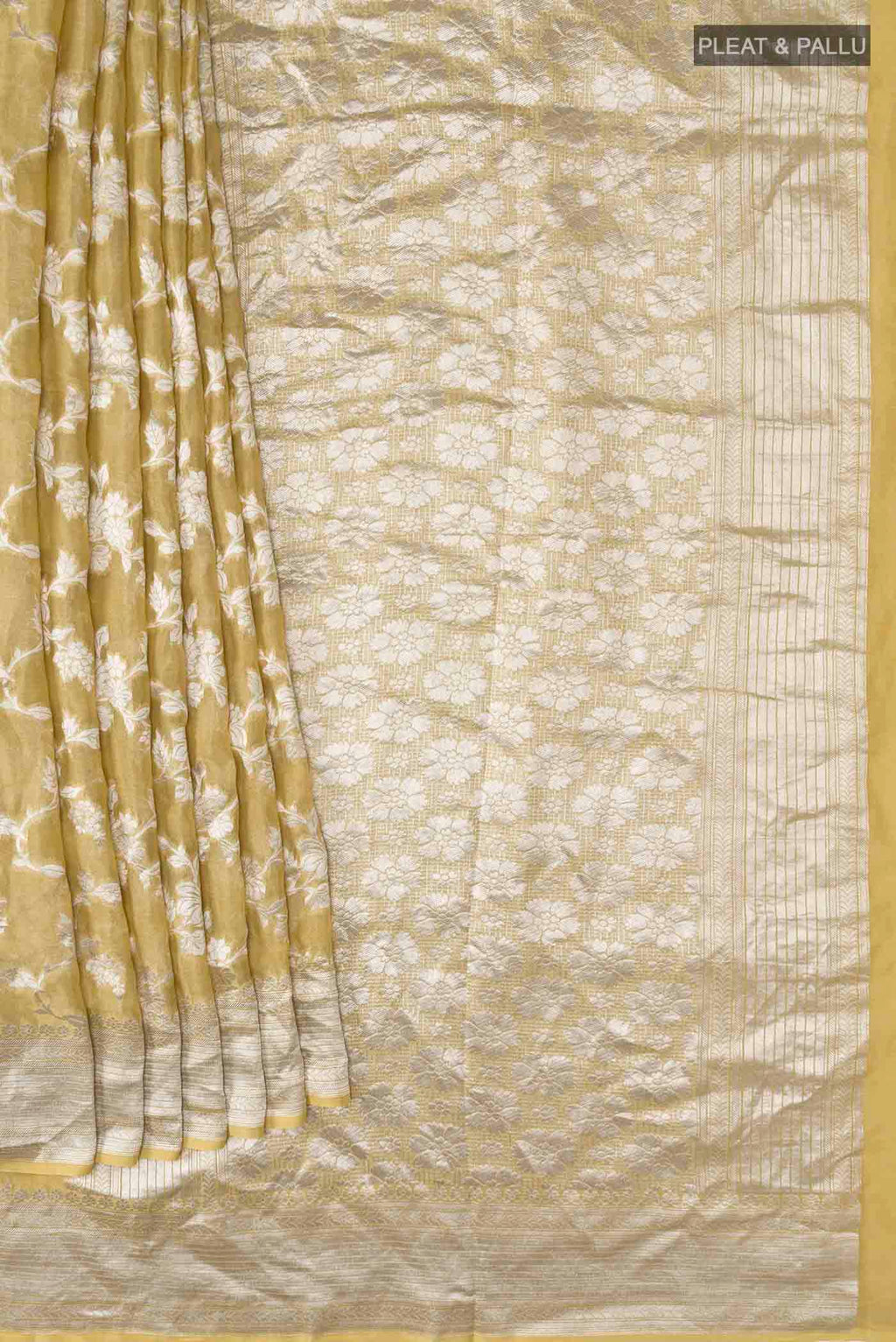 Pleats and pallu of Beige Banarasi Georgette Saree with Zari Butta on the body and Zari Border