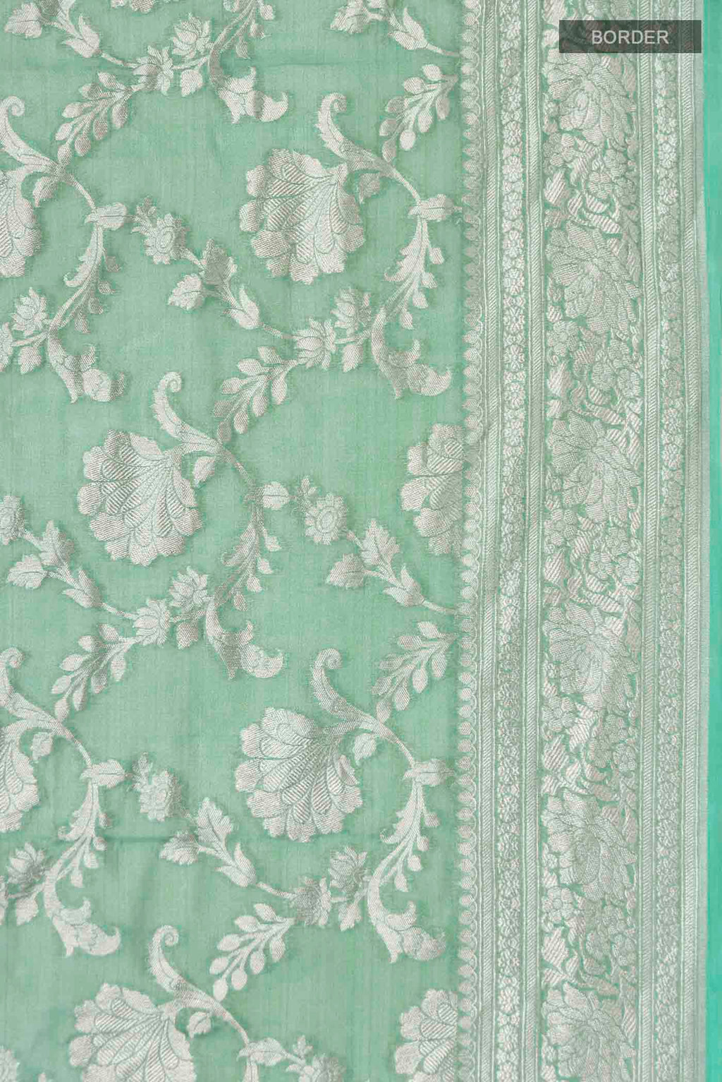 Border image of Green Banarasi Georgette Saree with Zari Butta on the body and Zari Border