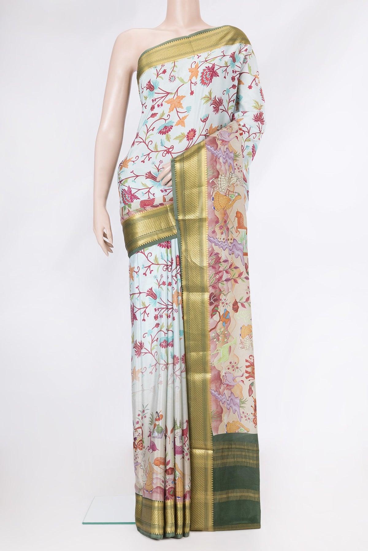 Light Blue Dual Tone Mysore Silk Saree with Printed design on the body and Zari Border.  displayed on a mannequin