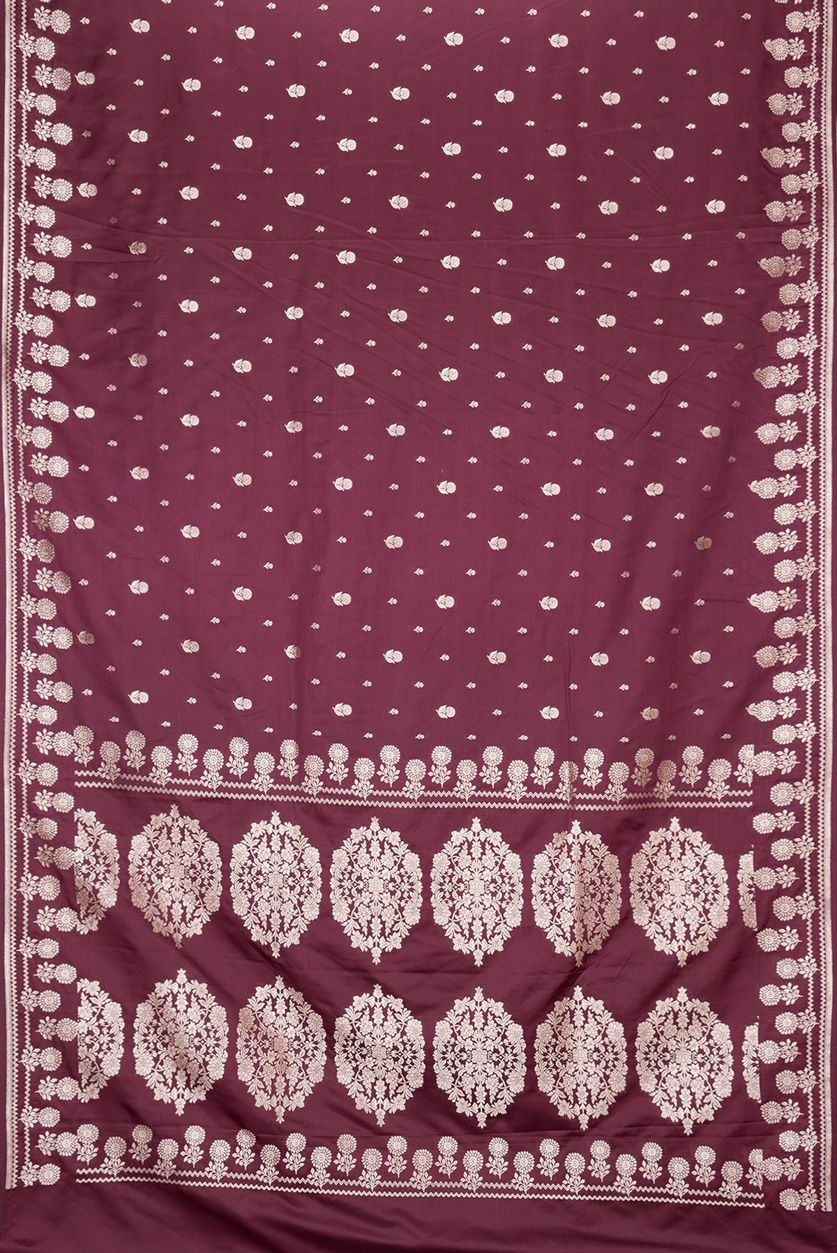 Flat view of Burgundy Dual Tone Banarasi Silk Saree with Zari Butta on the body and Zari Border. 
