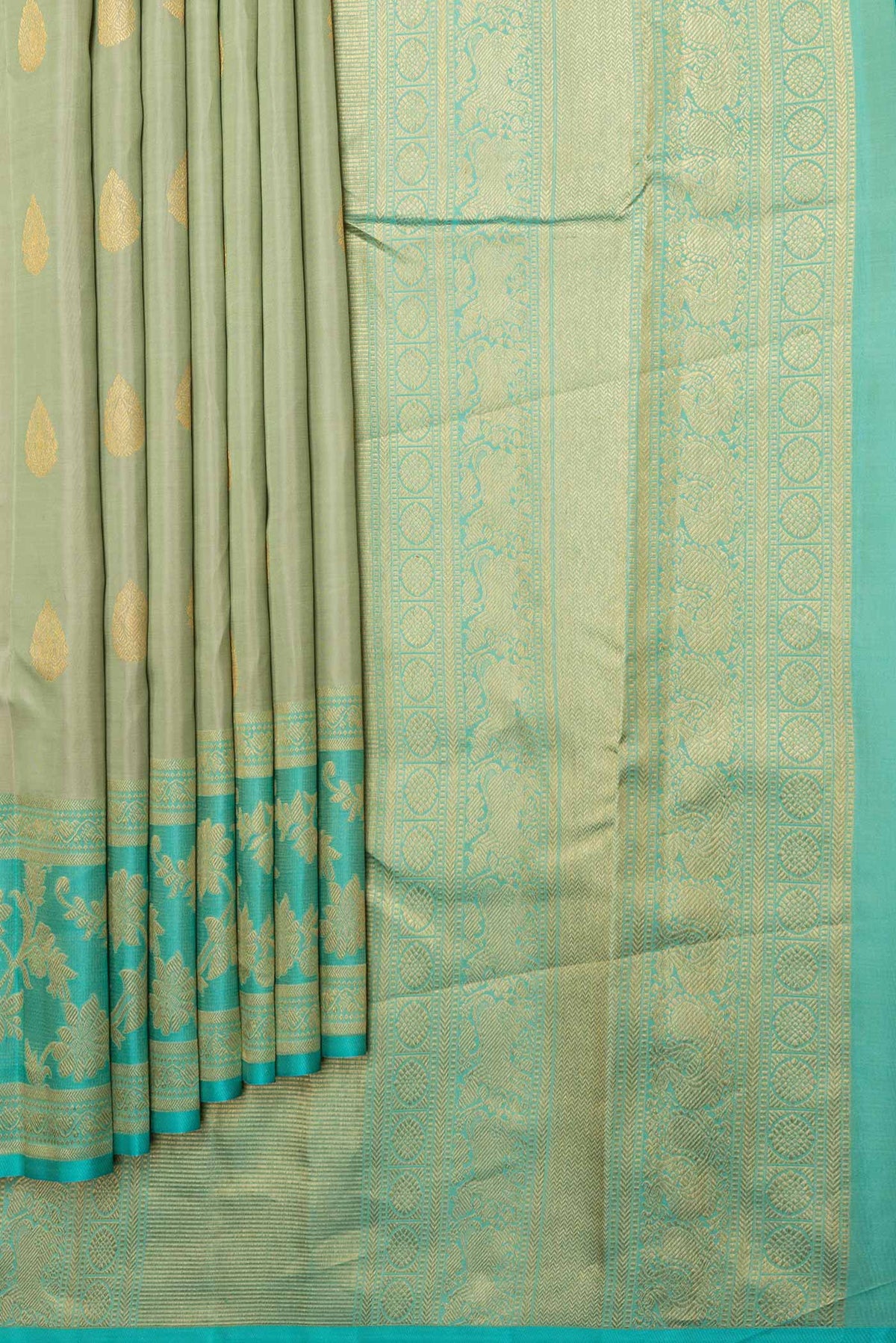 Pleats and pallu of Pista Green Dual Tone Kanchipuram Saree with Zari Butta on the body and Zari Border