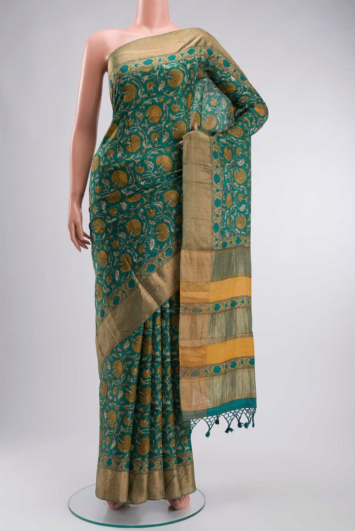 Green Bhagalpuri Tussar Silk Saree with Printed design on the body and Zari Border displayed on a mannequin
