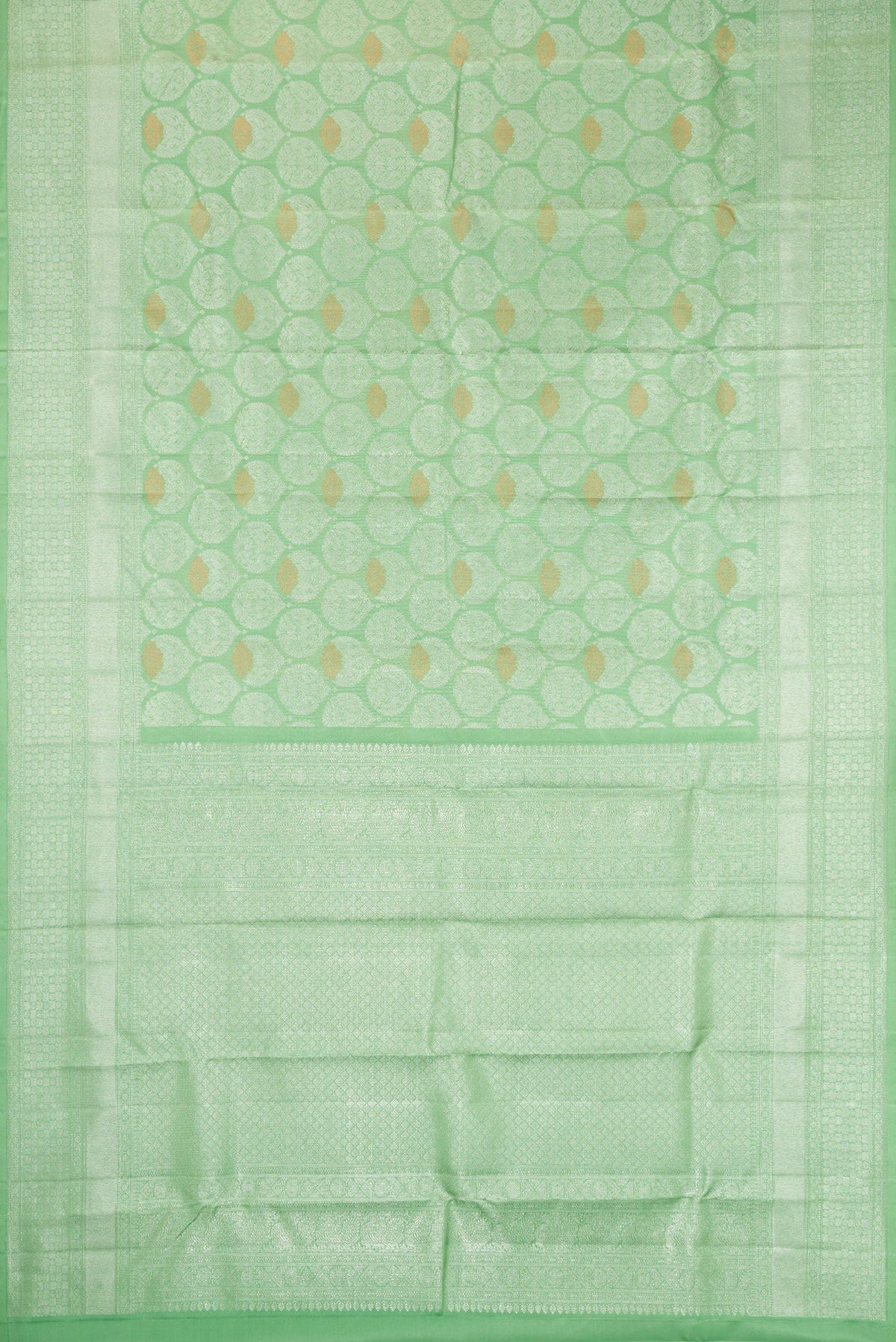 Flat view of Light Green Dual Tone Kanchipuram Silk Saree with Zari Brocade on the body and Zari Border. 
