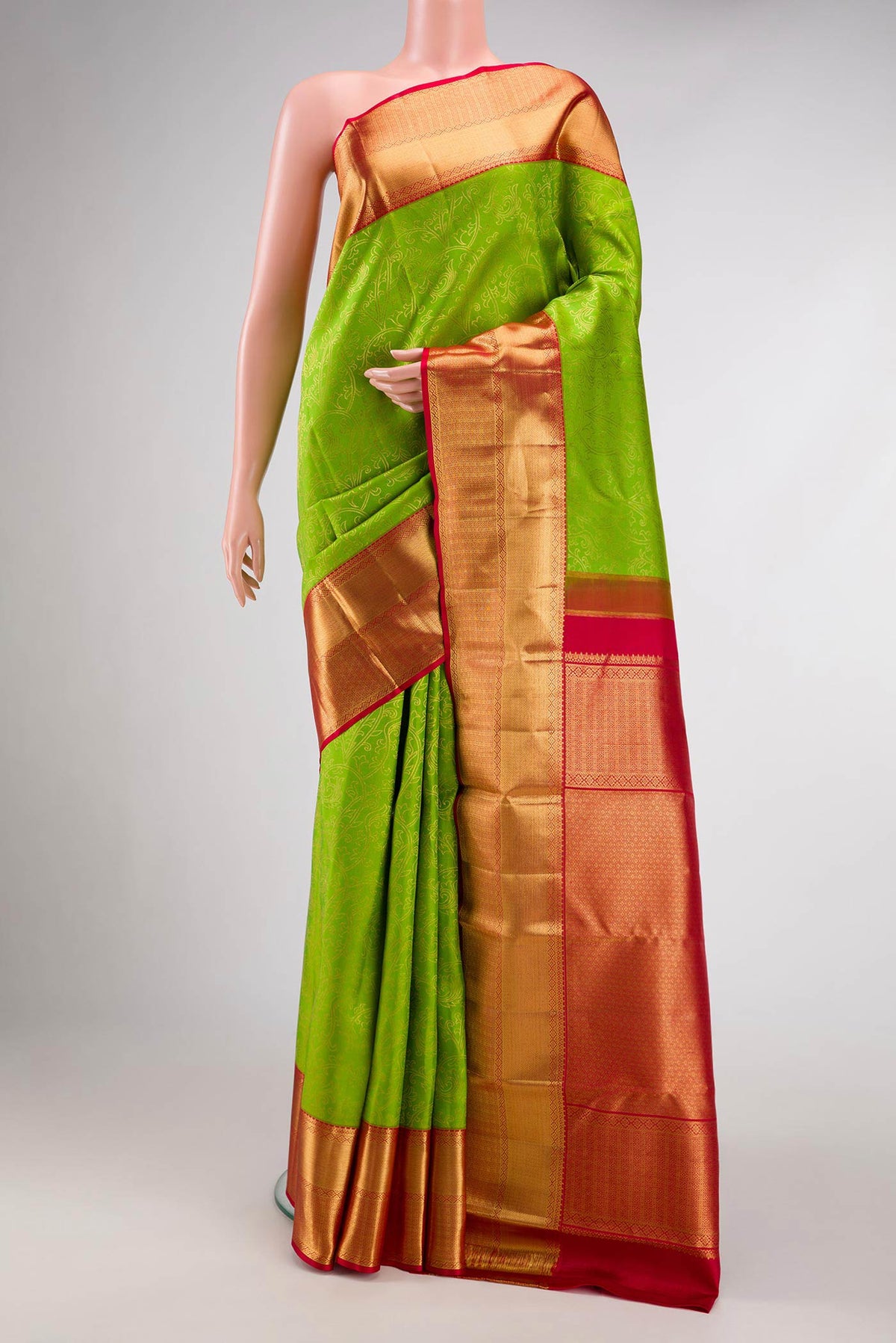 Parrot Green Dual Tone Kanchipuram Silk Saree with Zari Brocade on the body and Zari Border.  displayed on a mannequin