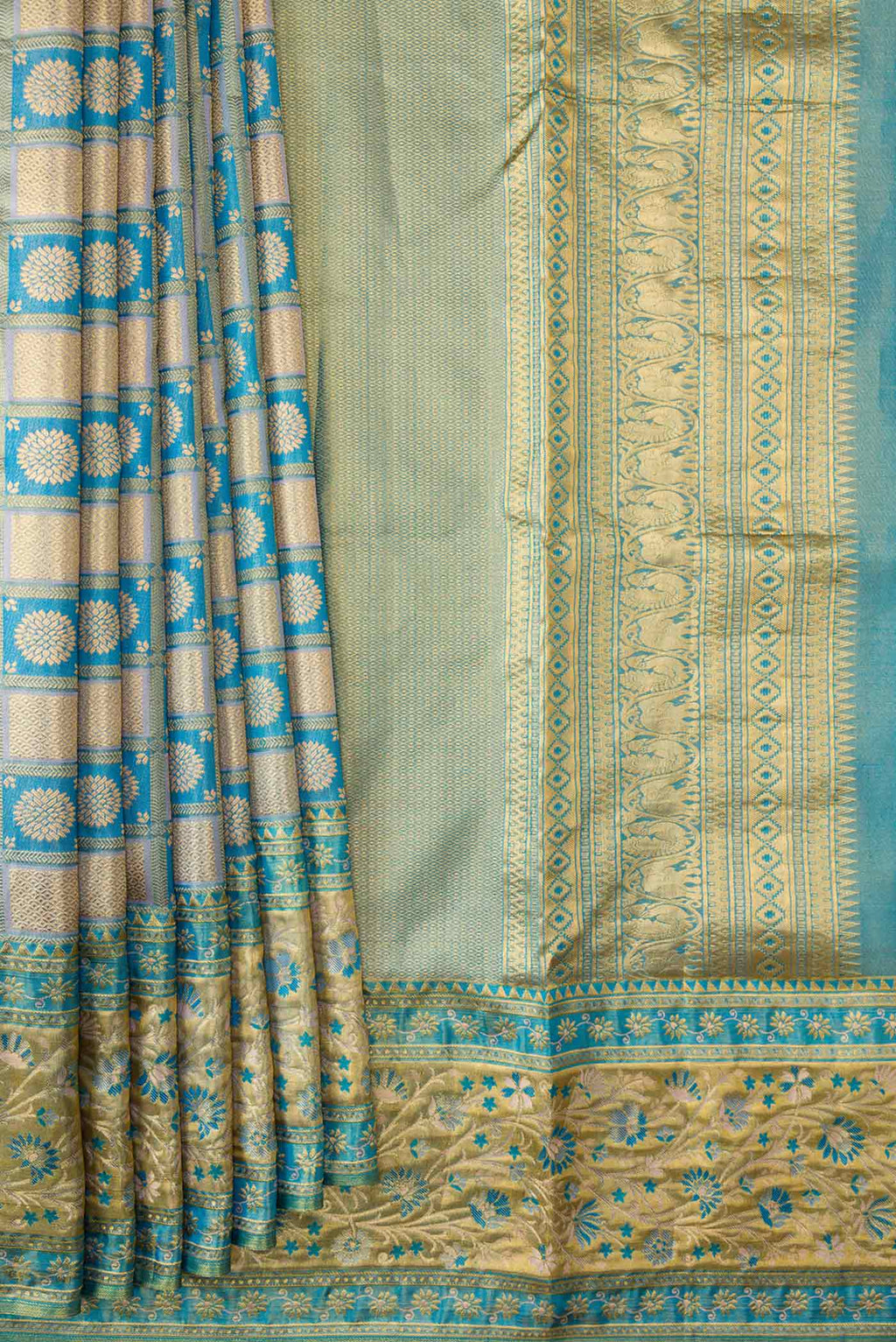 Pleats and pallu of Peacock Blue Dual Tone Kanchipuram Tissue Silk Saree with Zari Brocade on the body and Fancy Border