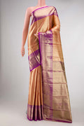 Gold Dual Tone Kanjivaram Tissue Silk Saree with Zari Brocade on the body and Zari Border.  displayed on a mannequin