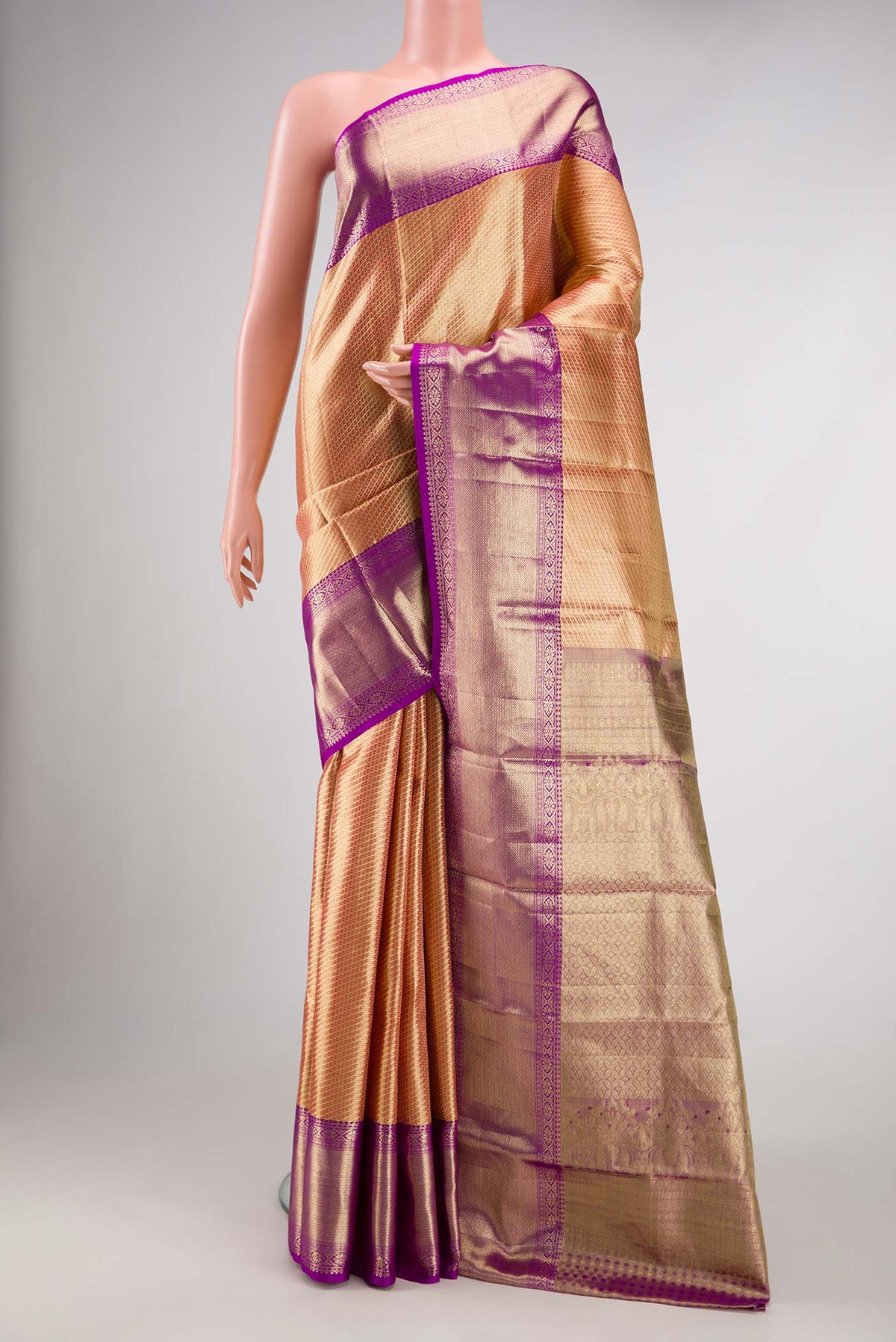 Gold Dual Tone Kanjivaram Tissue Silk Saree with Zari Brocade on the body and Zari Border.  displayed on a mannequin