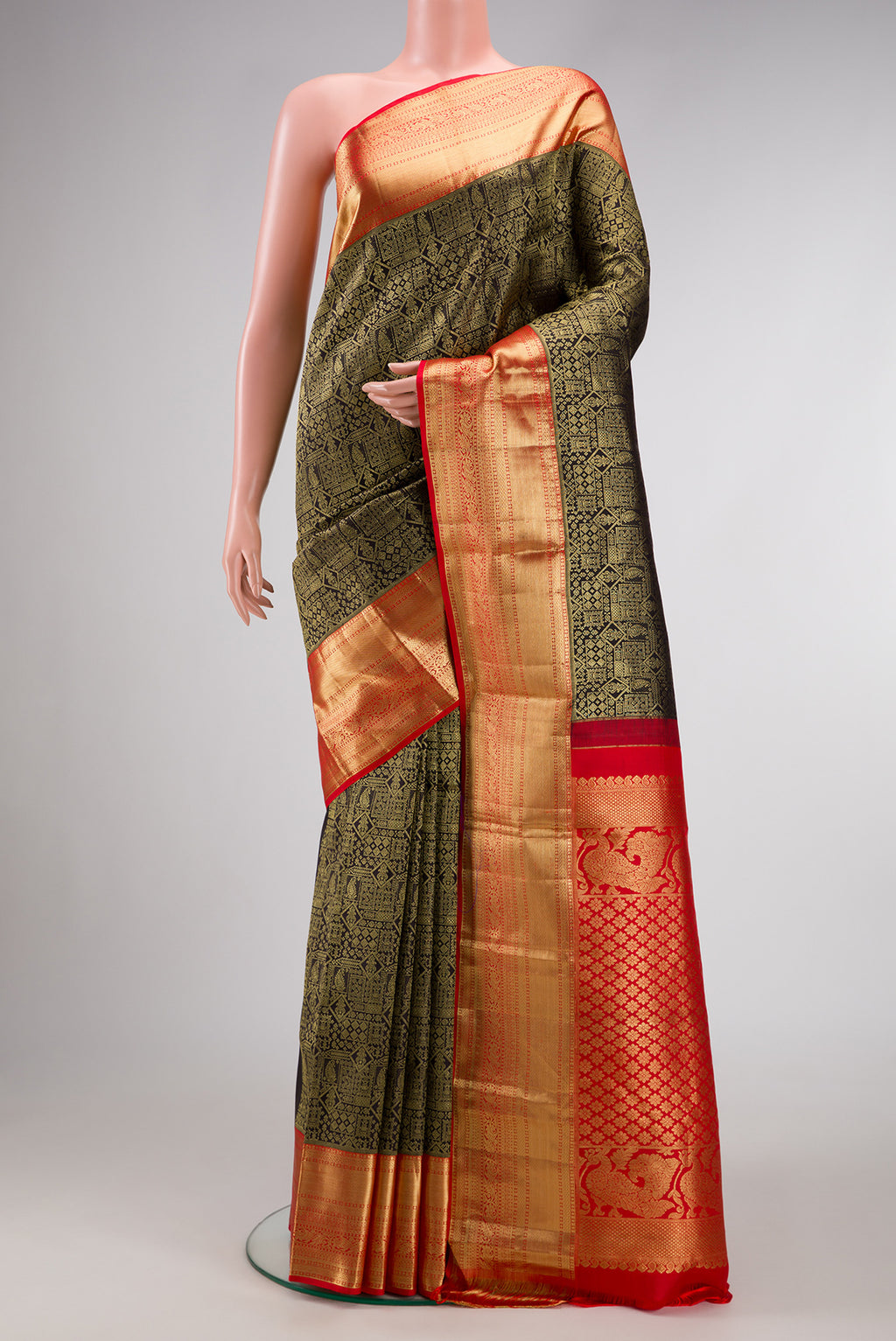 Black Kanjivaram Silk Saree with Zari Brocade on the body and Zari Border.  displayed on a mannequin