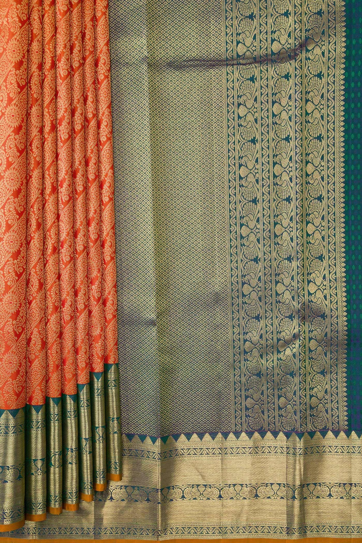 Pleats and pallu of Orange Dual Tone Kanjivaram Silk Saree with Zari Brocade on the body and Zari Border. 