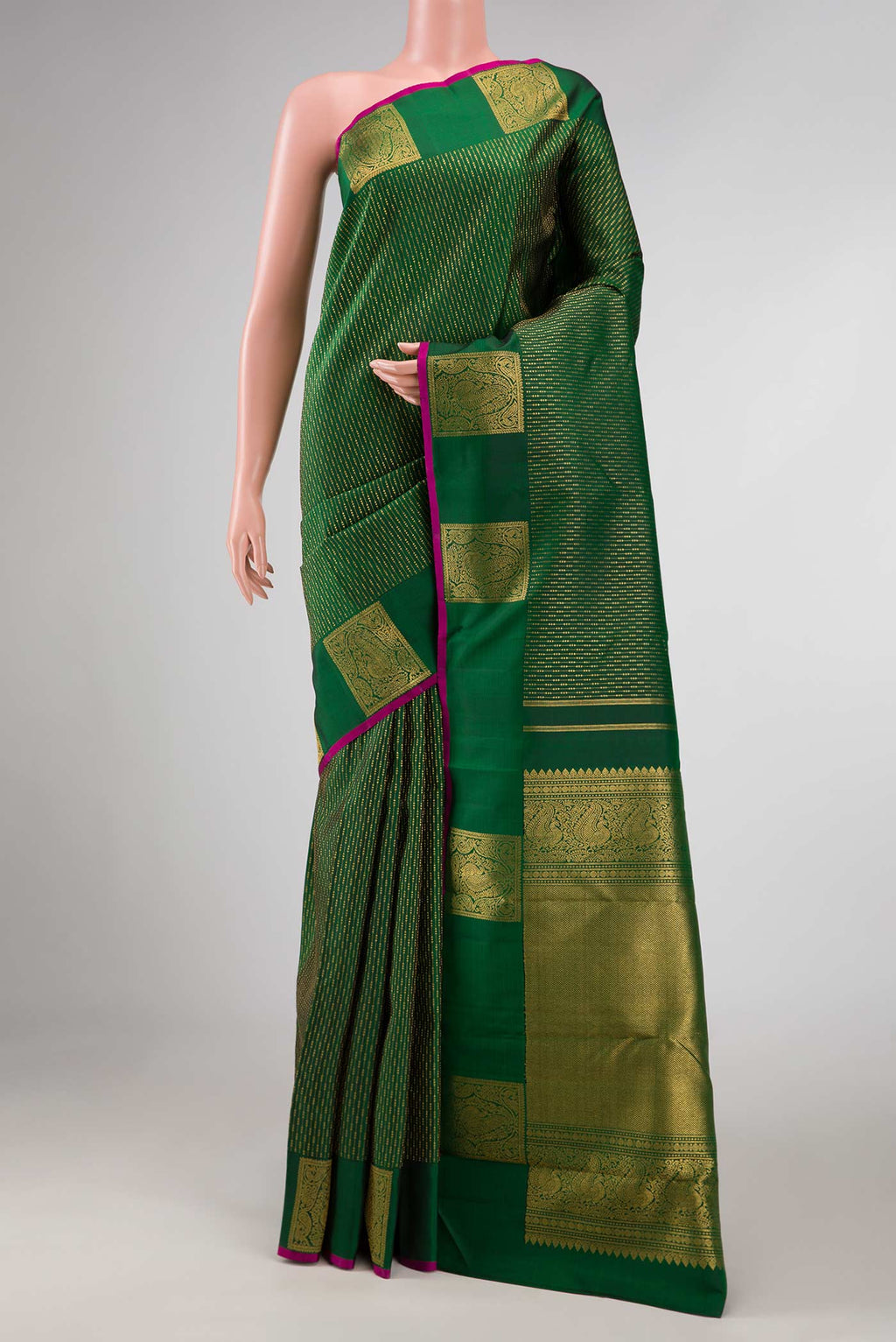 Green Dual Tone Kanchipuram Silk Saree with Stripes on the body and Fancy Border displayed on a mannequin