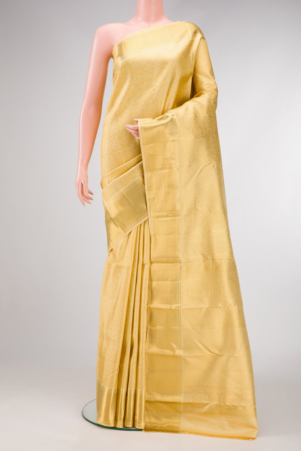 Sandal Dual Tone Kanjivaram Silk Saree with Zari Brocade on the body and Zari Border.  displayed on a mannequin