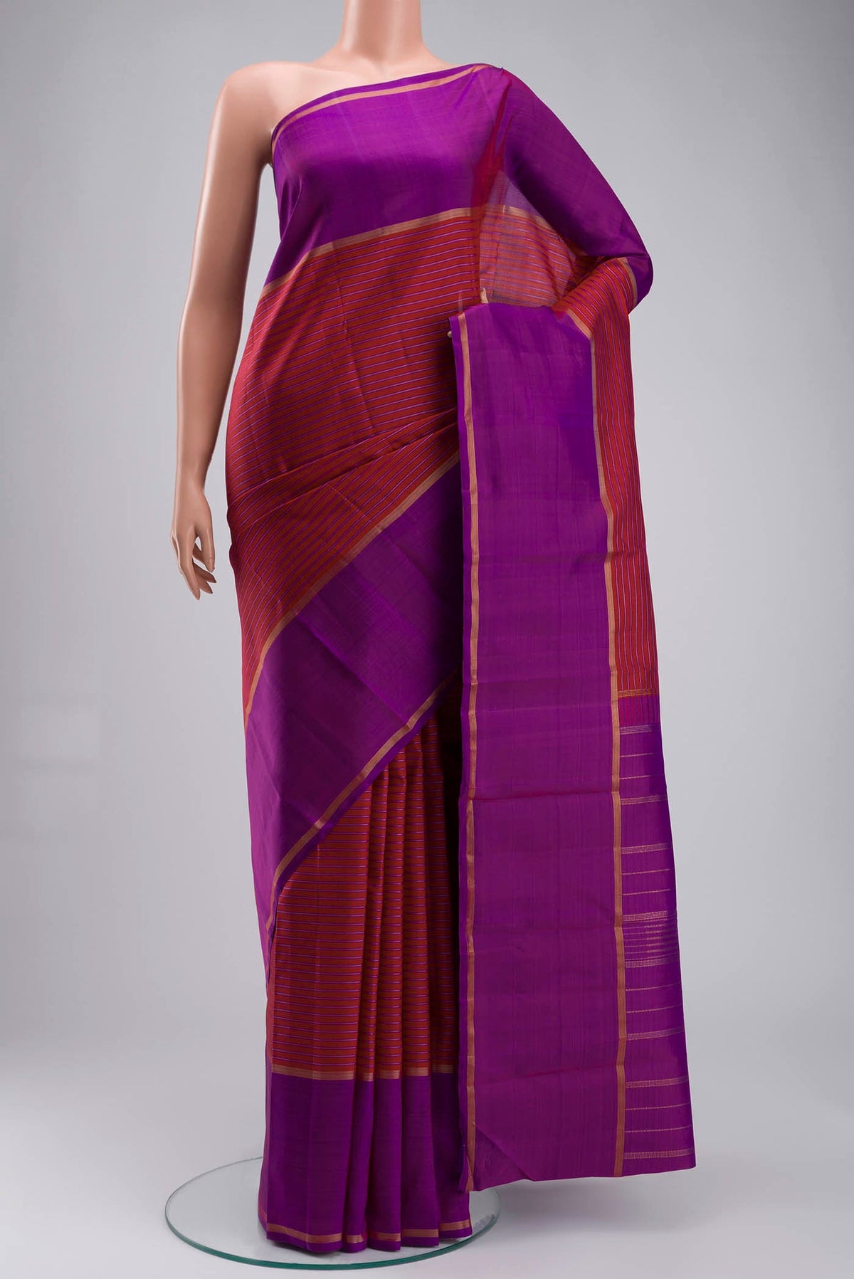 Maroon Kanchipuram Silk Saree with Stripes on the body and Zari Border displayed on a mannequin