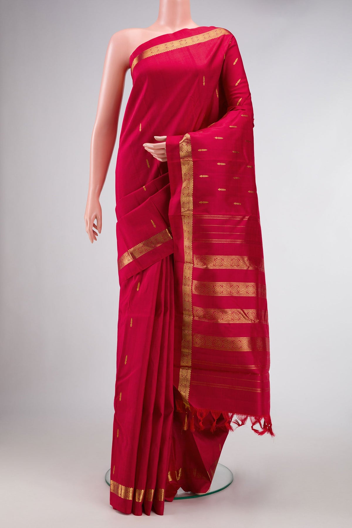 Maroon Dual Tone Kanchipuram Silk Saree with Zari Butta on the body and Zari Border.  displayed on a mannequin