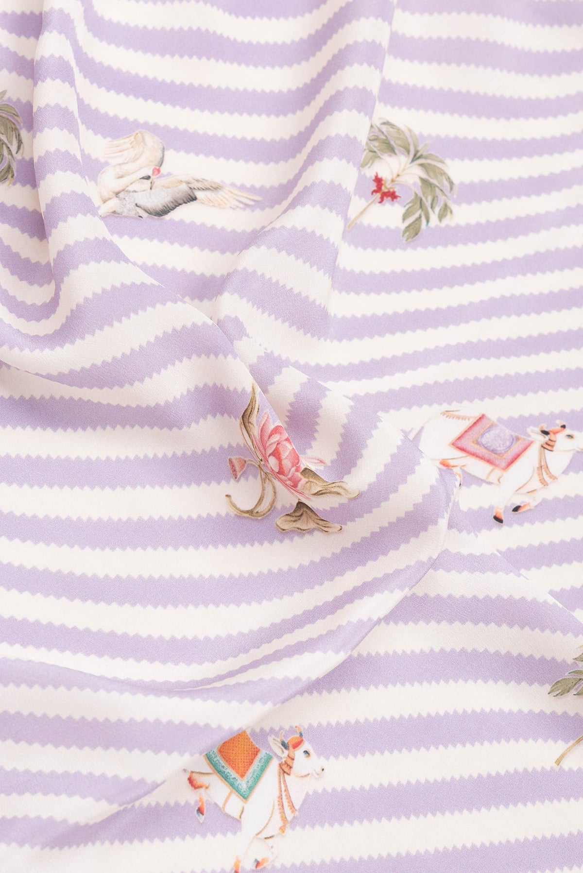 Close up of Lavender Mysore Crepe Saree with Printed design on the body and Plain Border.  displaying folds