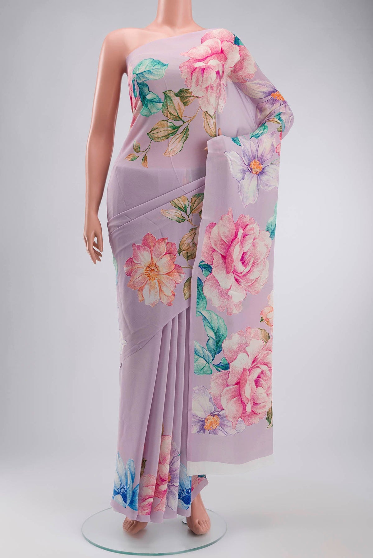 Lavender Mysore Crepe Saree with Printed design on the body and Printed Border displayed on a mannequin