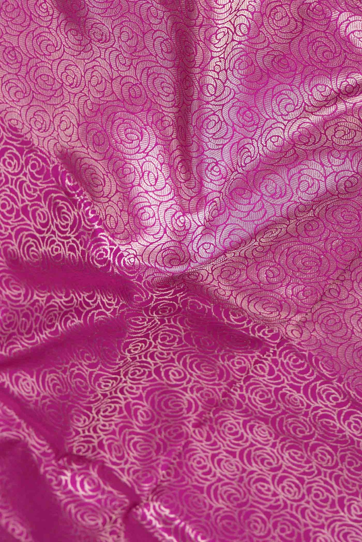 Close up of Pink Dual Tone Banarasi Silk Saree with Zari Brocade on the body and Zari Border displaying folds