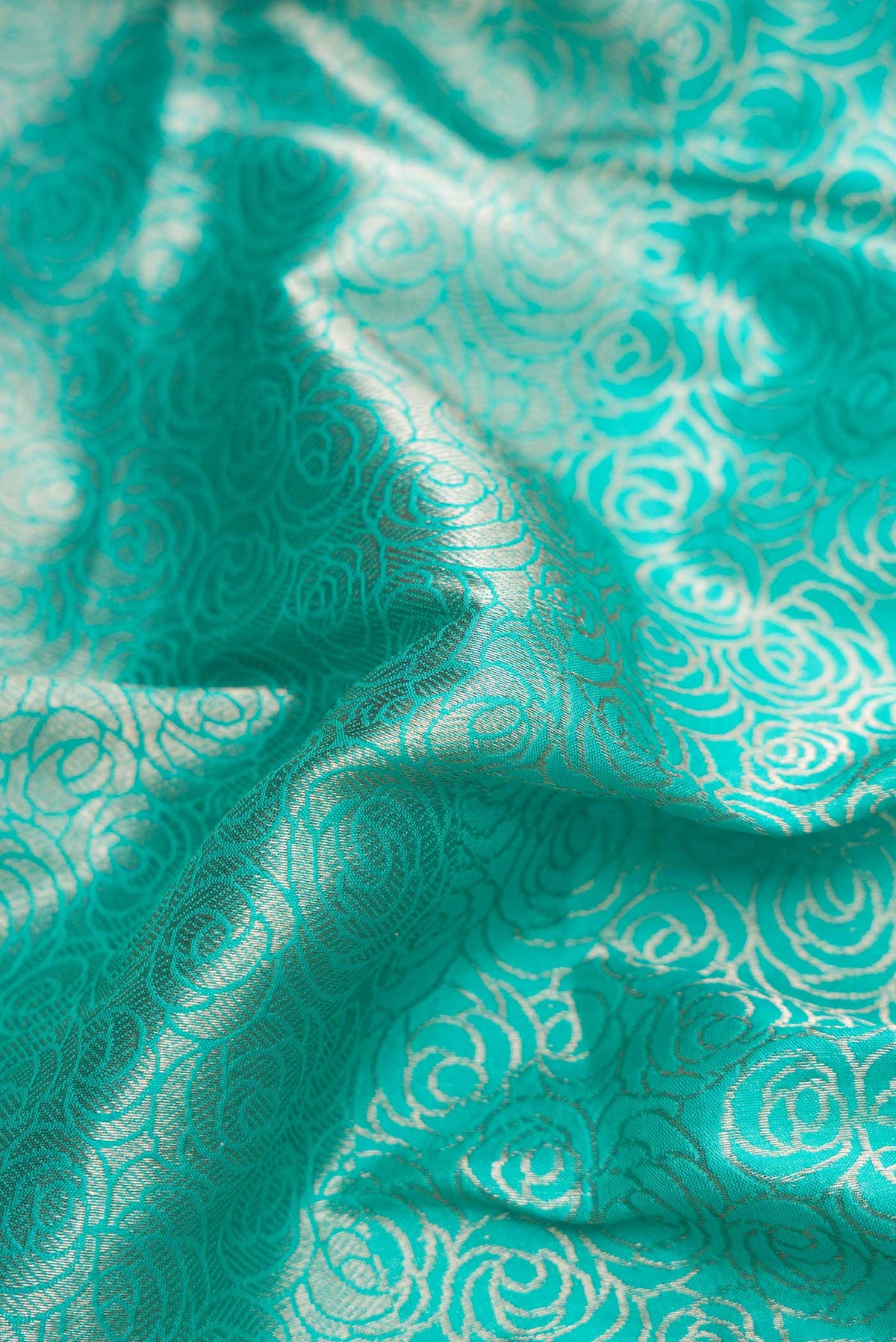 Close up of Sky Blue Dual Tone Banarasi Silk Saree with Zari Brocade on the body and Zari Border displaying folds