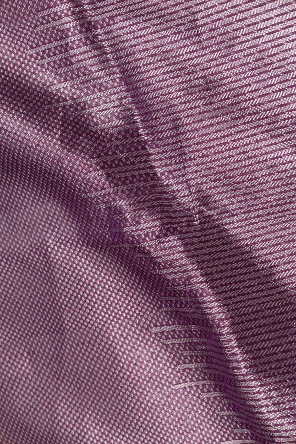 Close up of Violet Banarasi Silk Saree with Zari Brocade on the body and Zari Border displaying folds