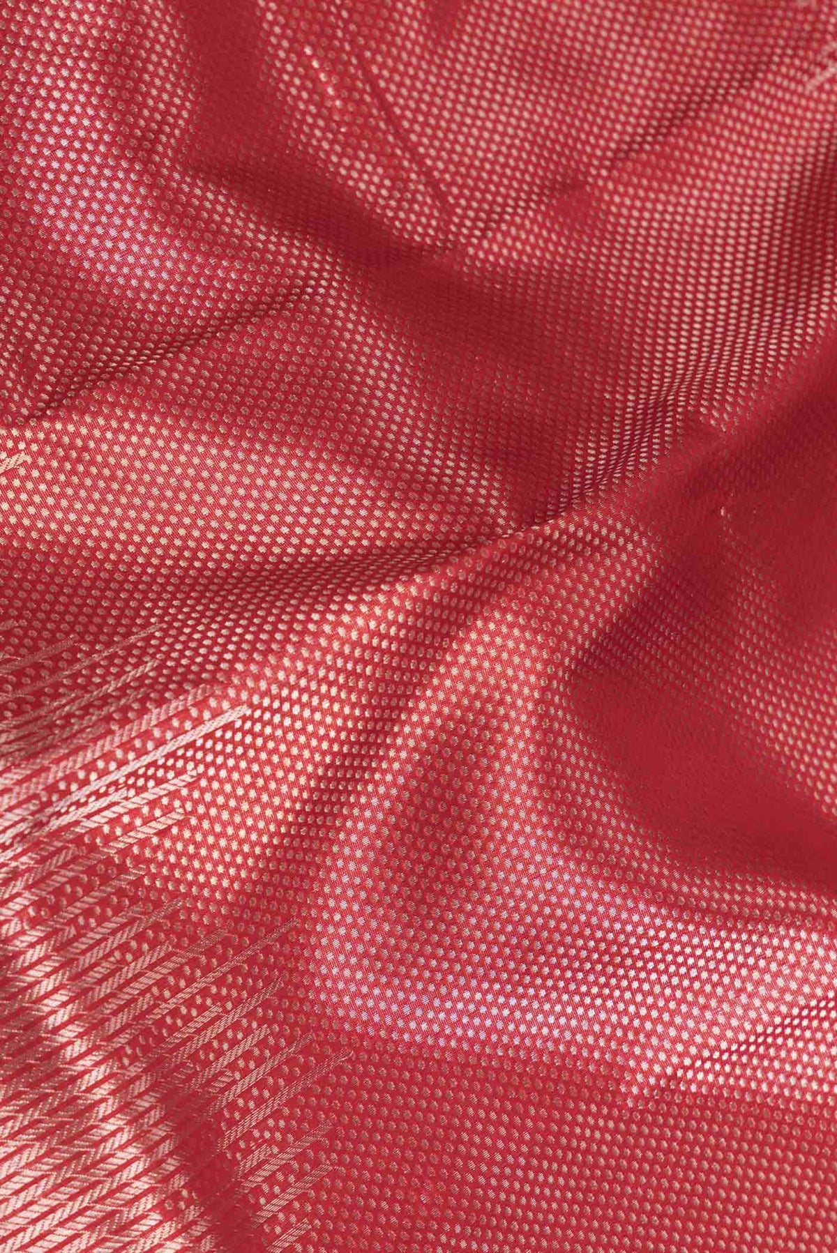 Close up of Red Dual Tone Banarasi Silk Saree with Zari Brocade on the body and Zari Border displaying folds