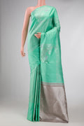 Sea Green Dual Tone Kanchipuram Silk Saree with Jacquard design on the body and Fancy Border displayed on a mannequin