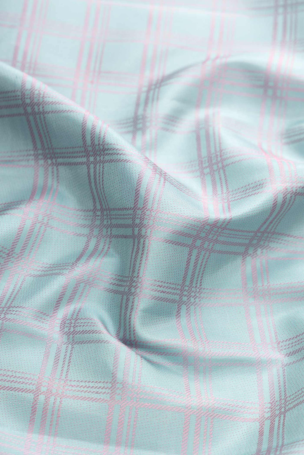 Close up of Sky Blue Dual Tone Kanchipuram Silk Saree with Checked design on the body and Fancy Border displaying folds