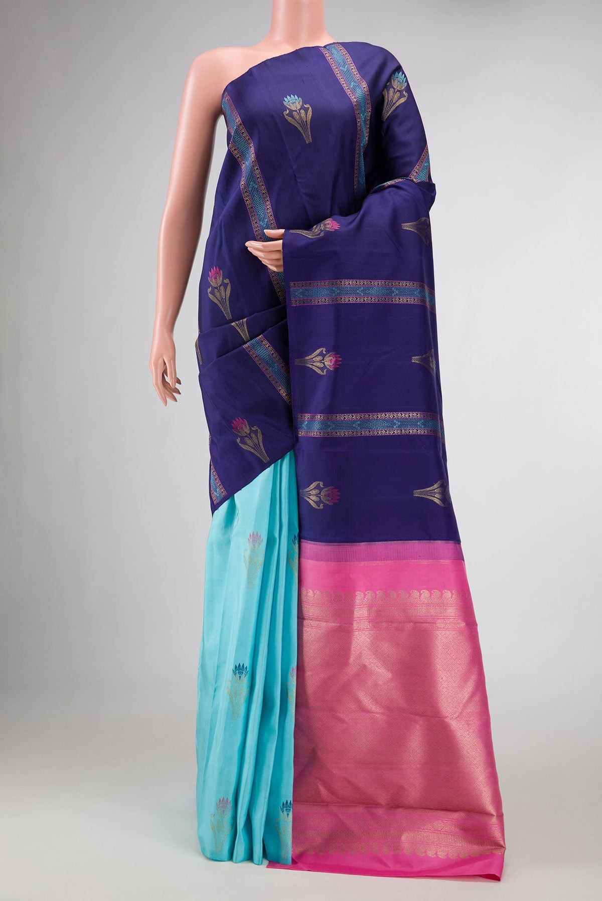 Sky Blue and Navy Blue Color Kanchipuram Silk Saree with Half And Half on the body and Without Border displayed on a mannequin
