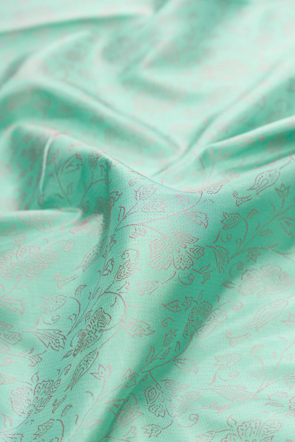 Close up of Pure Silk Pure Zari Sea Green Dual Tone Kanchipuram Saree with Jacquard design on the body and Fancy Border displaying folds