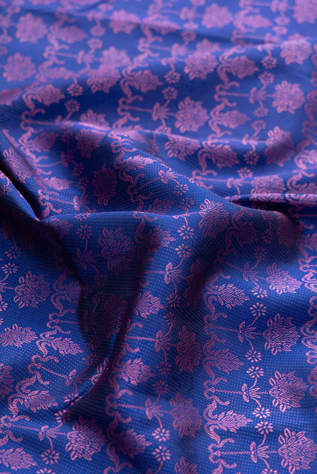 Close up of Pure Silk Pure Zari Royal Blue Dual Tone Kanchipuram Saree with Jacquard design on the body and Fancy Border displaying folds