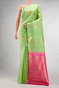 Pista Green Dual Tone Kanchipuram Silk Saree with Stripes on the body and Without Border displayed on a mannequin