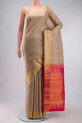 Beige Kanchipuram Silk Saree with Zari Butta on the body and Zari Border displayed on a mannequin