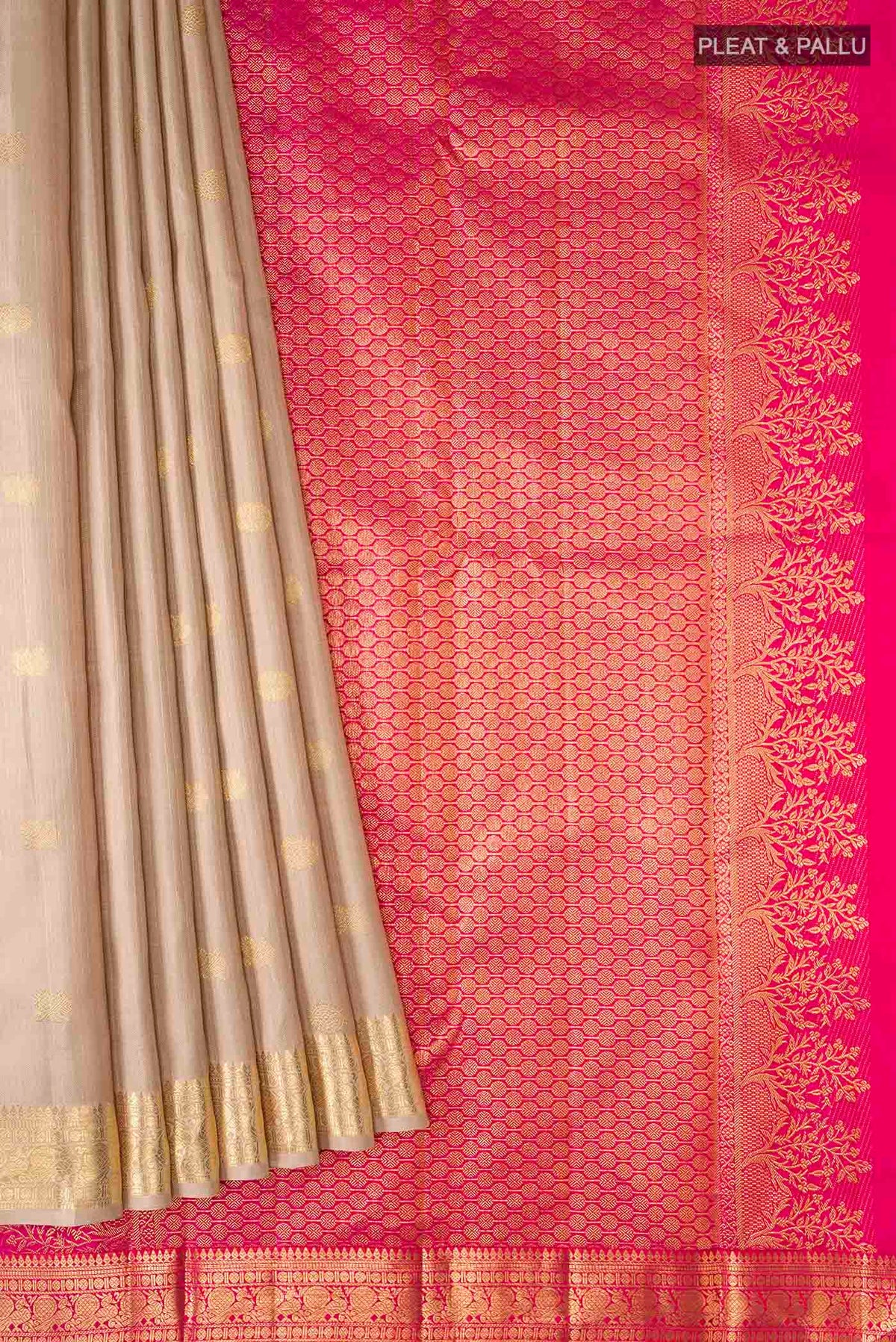 Pleats and pallu of Beige Kanchipuram Silk Saree with Zari Butta on the body and Zari Border