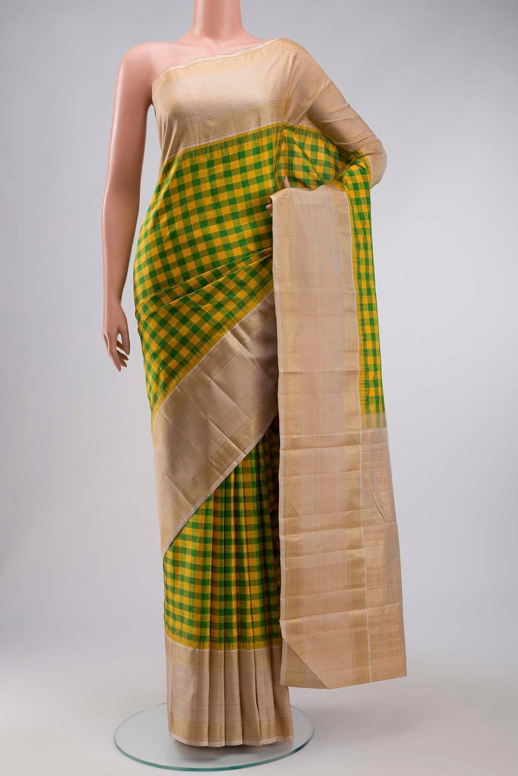 Multi Color Kanchipuram Silk Saree with Checked design on the body and Zari Border displayed on a mannequin