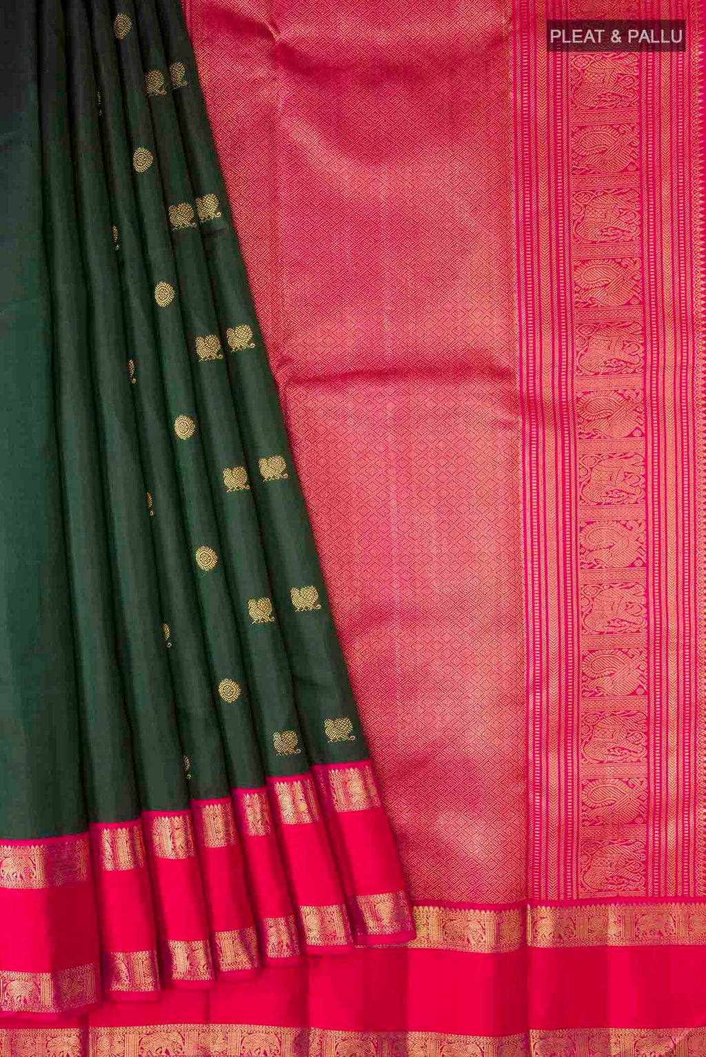 Pleats and pallu of Green Kanchipuram Silk Saree with Zari Butta on the body and Zari Border