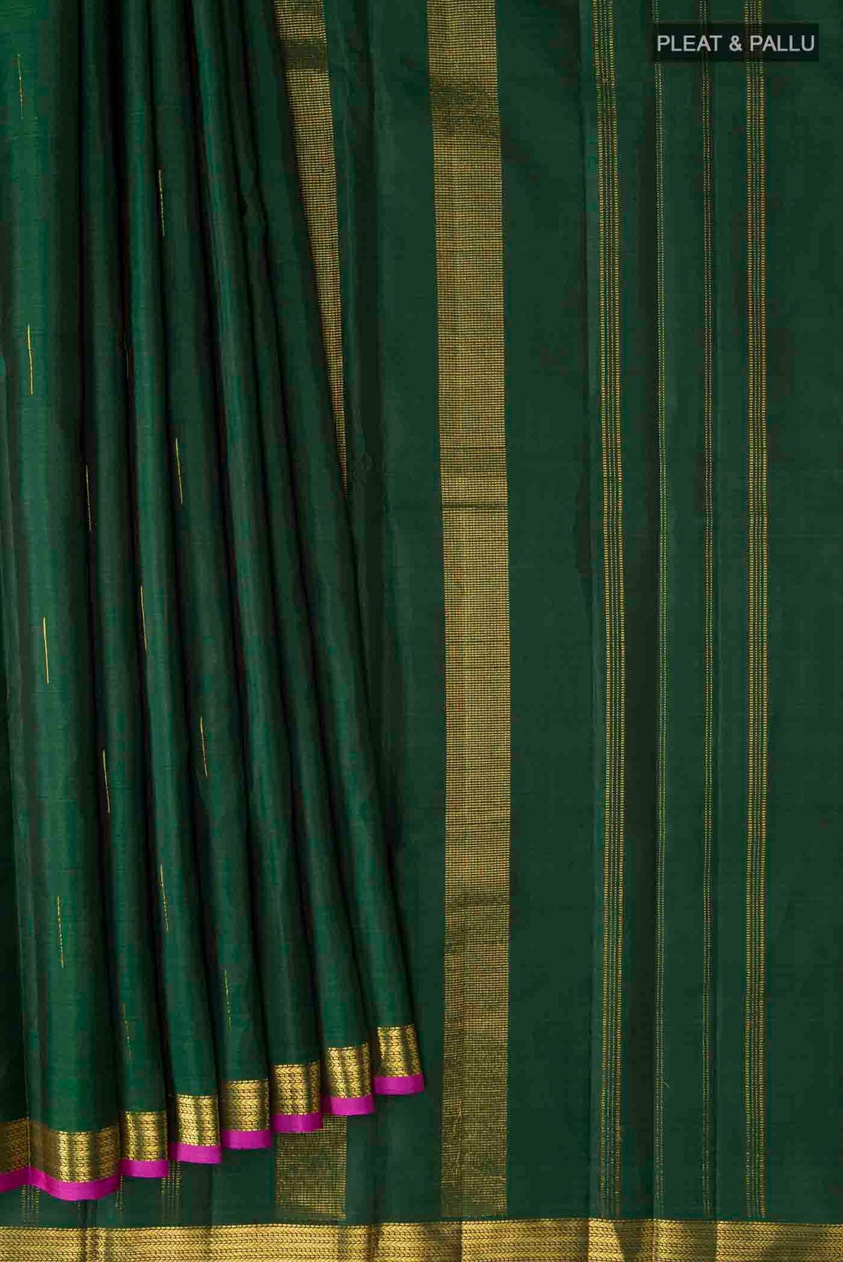 Pleats and pallu of Green Kanchipuram Silk Saree with Zari Butta on the body and Zari Border