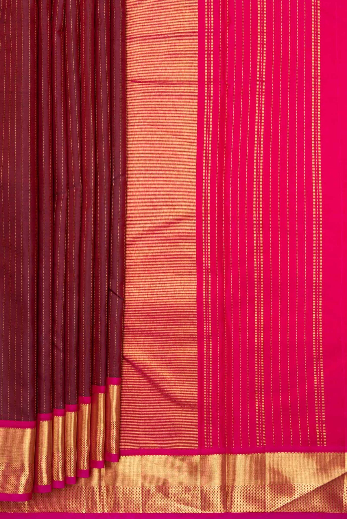 Pleats and pallu of Maroon Dual Tone Kanchipuram Silk Saree with Stripes on the body and Zari Border