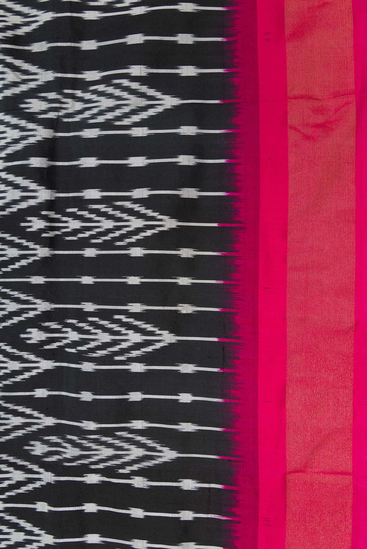 Border image of Black Dual Tone Double Ikat Saree with Ikat Print on the body and Ikat Border. 