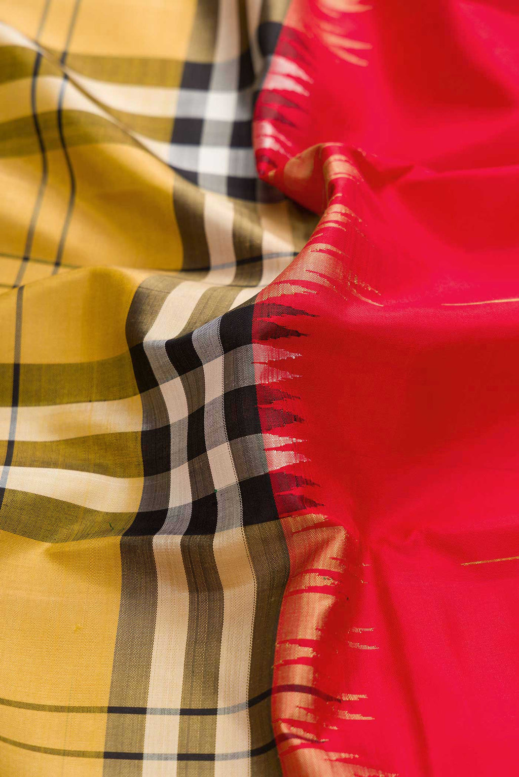 Close up of Red and Mustard Color Kanchipuram Silk Saree with Half And Half on the body and Without Border displaying folds