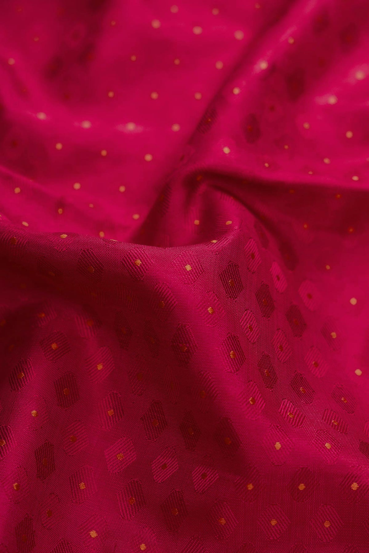 Close up of Pure Silk Pure Zari Maroon Dual Tone Kanchipuram Saree with Jacquard design on the body and Zari Border.  displaying folds