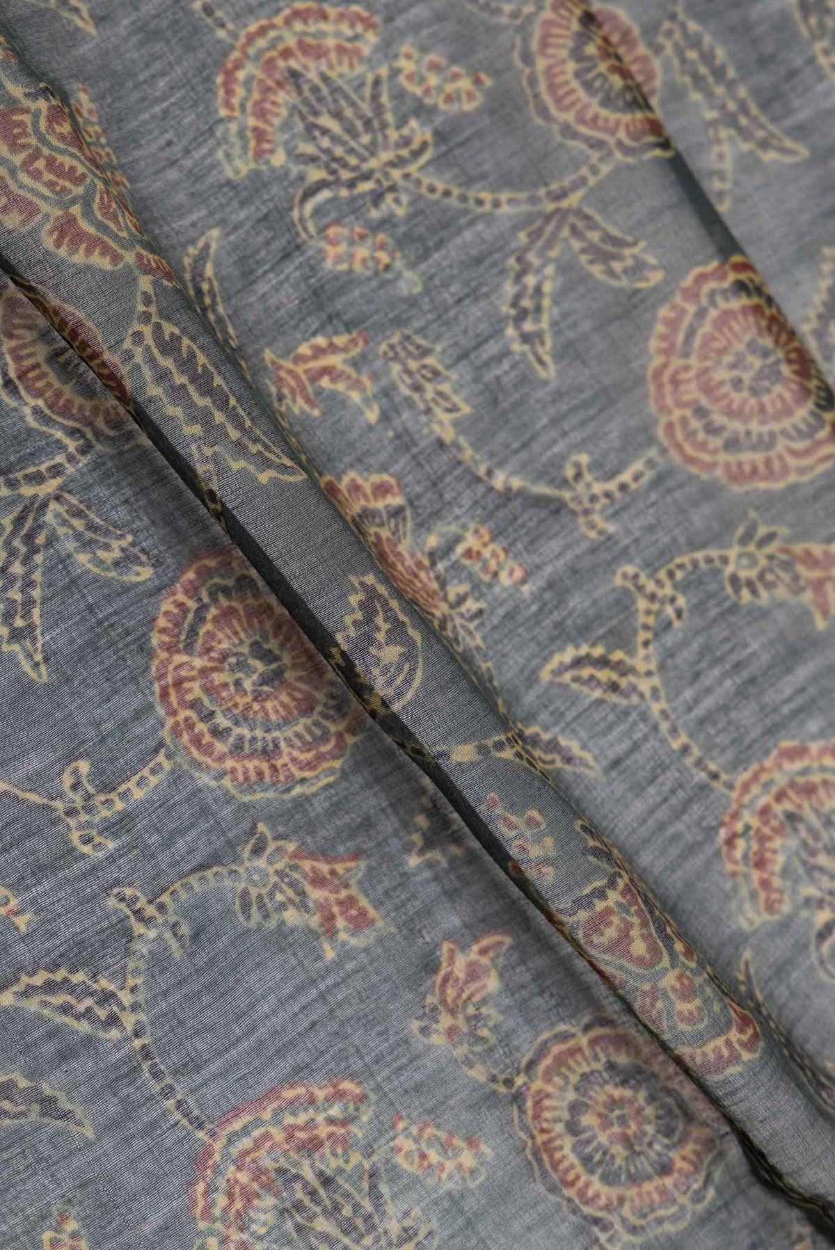 Close up of Green Dual Tone Chanderi Silk Saree with Printed design on the body and Zari Border displaying folds