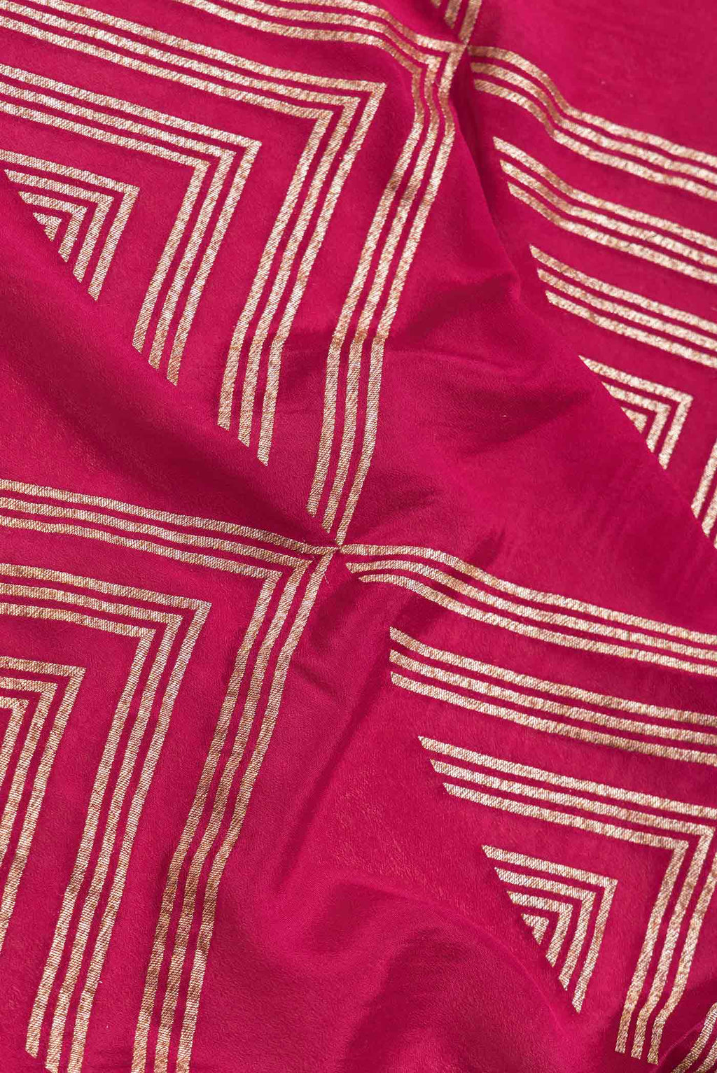 Close up of Pink Dual Tone Banarasi Georgette Saree with Zari Brocade on the body and Zari Border.  displaying folds