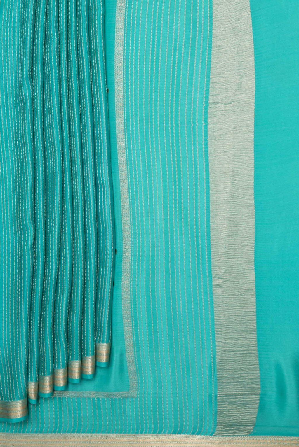 Pleats and pallu of Sky Blue Mysore Crepe Saree with Stripes on the body and Zari Border