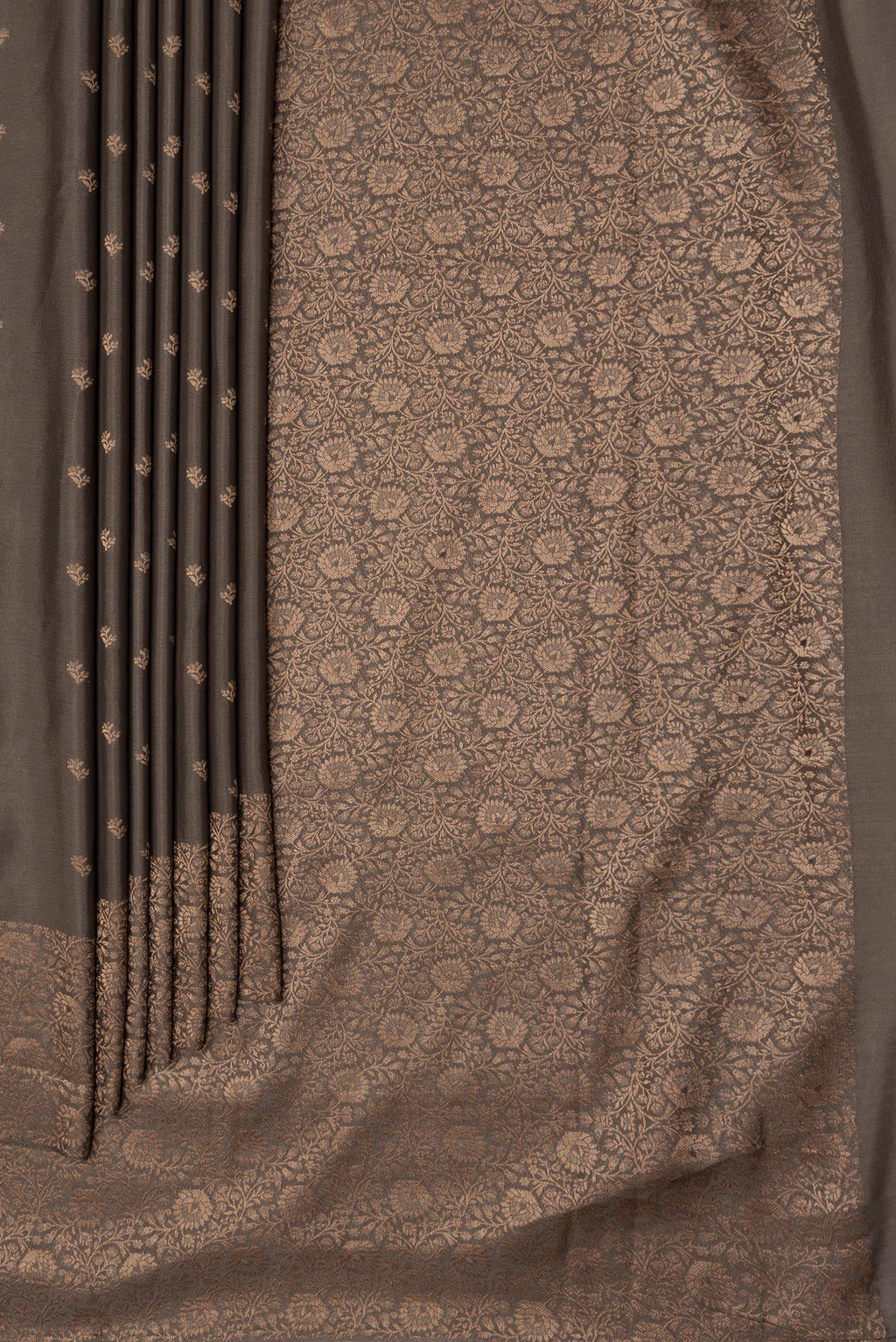 Pleats and pallu of Brown Dual Tone Mysore Crepe Saree with Zari Butta on the body and Zari Border. 