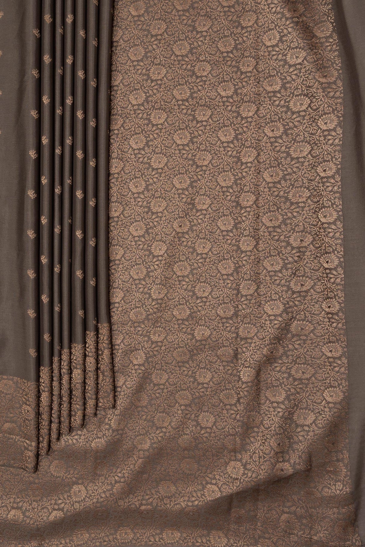Pleats and pallu of Brown Dual Tone Mysore Crepe Saree with Zari Butta on the body and Zari Border. 