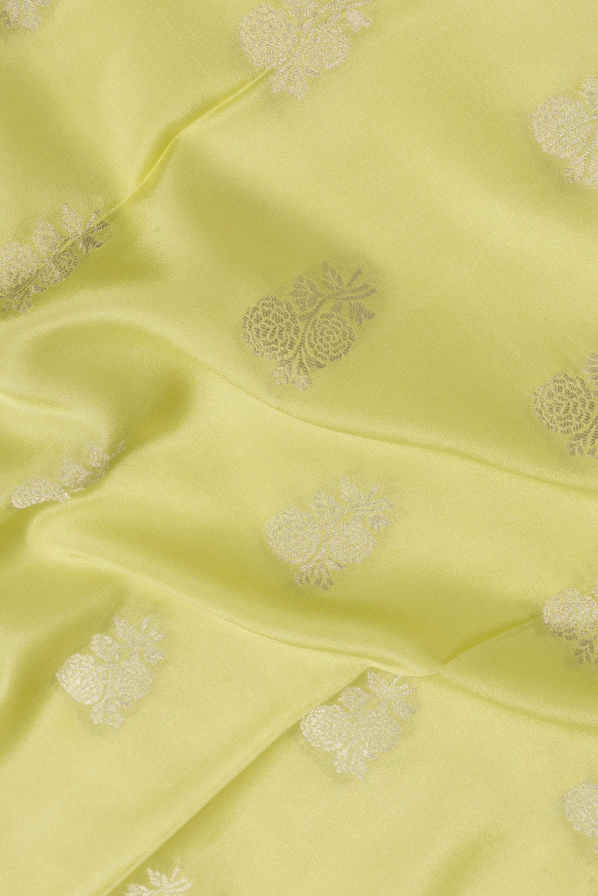 Close up of Pista Green Dual Tone Mysore Silk Saree with Zari Butta on the body and Zari Border.  displaying folds