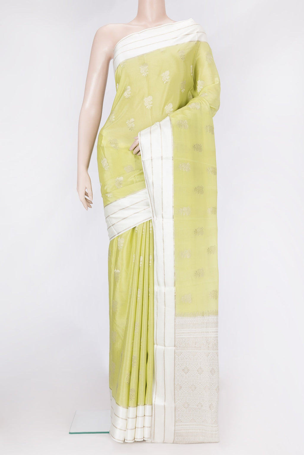 Pista Green Dual Tone Mysore Silk Saree with Zari Butta on the body and Zari Border.  displayed on a mannequin