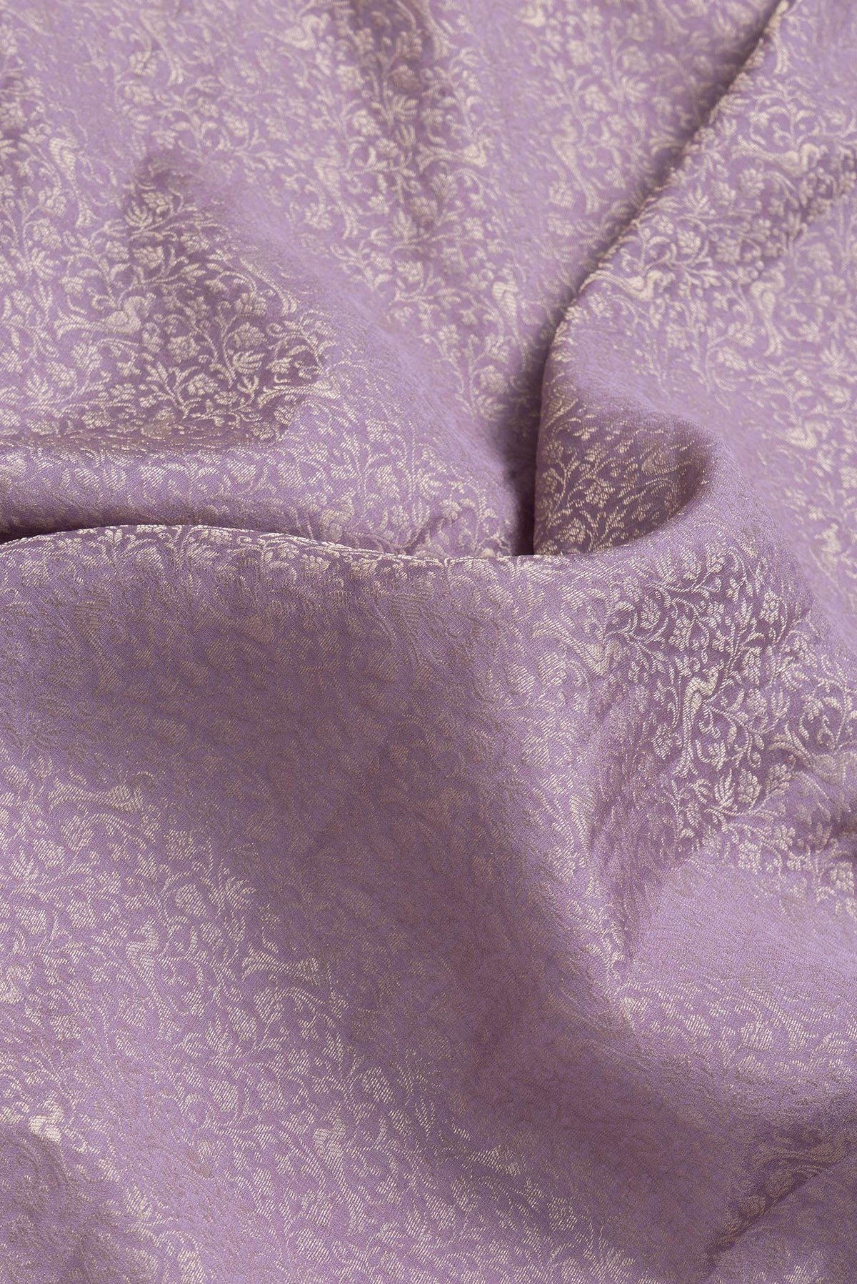 Close up of Lavender Dual Tone Georgette Saree with Zari Brocade on the body and Fancy Border.  displaying folds