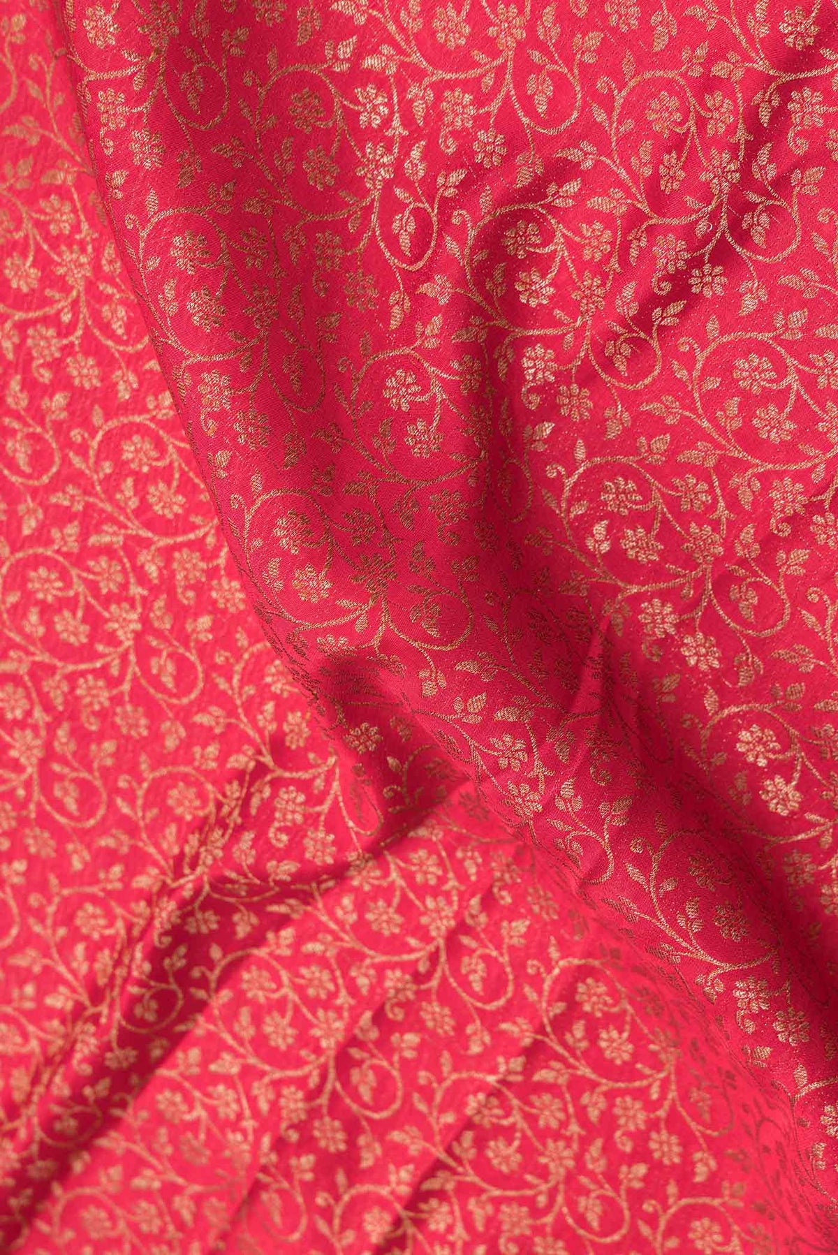 Close up of Pink Dual Tone Banarasi Silk Saree with Zari Brocade on the body and Zari Border.  displaying folds