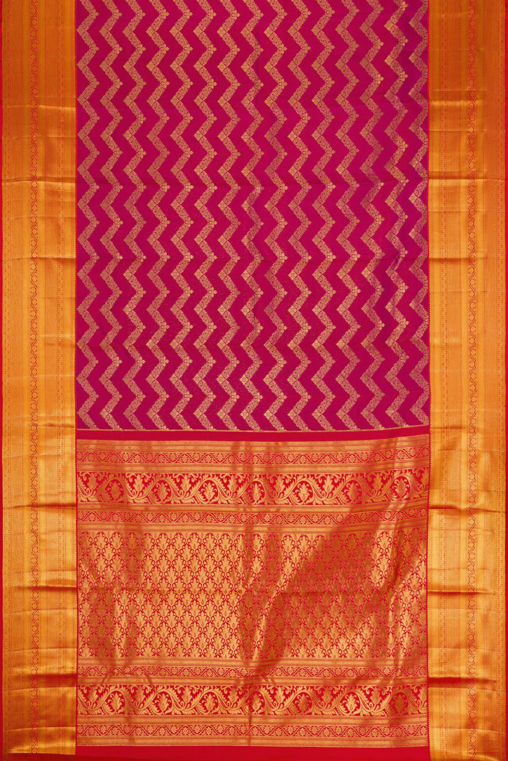 Flat view of Magenta Kanchipuram Silk Saree with Zari Brocade on the body and Zari Border. 