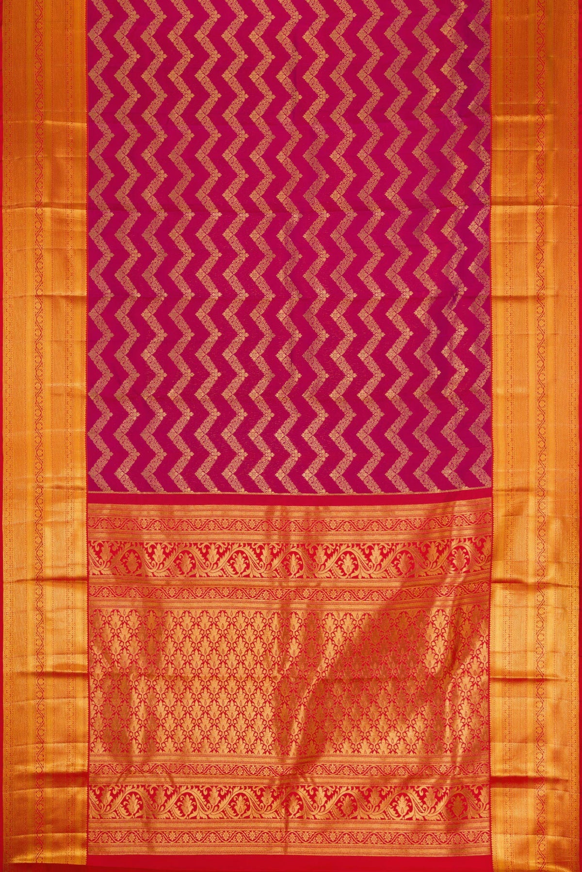 Flat view of Magenta Kanchipuram Silk Saree with Zari Brocade on the body and Zari Border. 